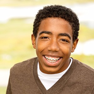 Boy with braces smiling